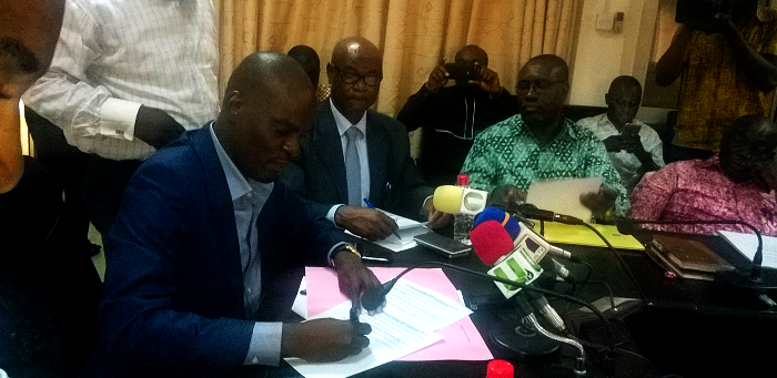 Mr Iddrisu signing on behalf of the government Mr Iddrisu signing on behalf of the government